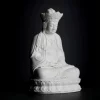 Opposite angled view of the crowned figure, folded legs and lotus pedestal on the 22 cm (8.7 in) Pilu Guanyin statue in white porcelain