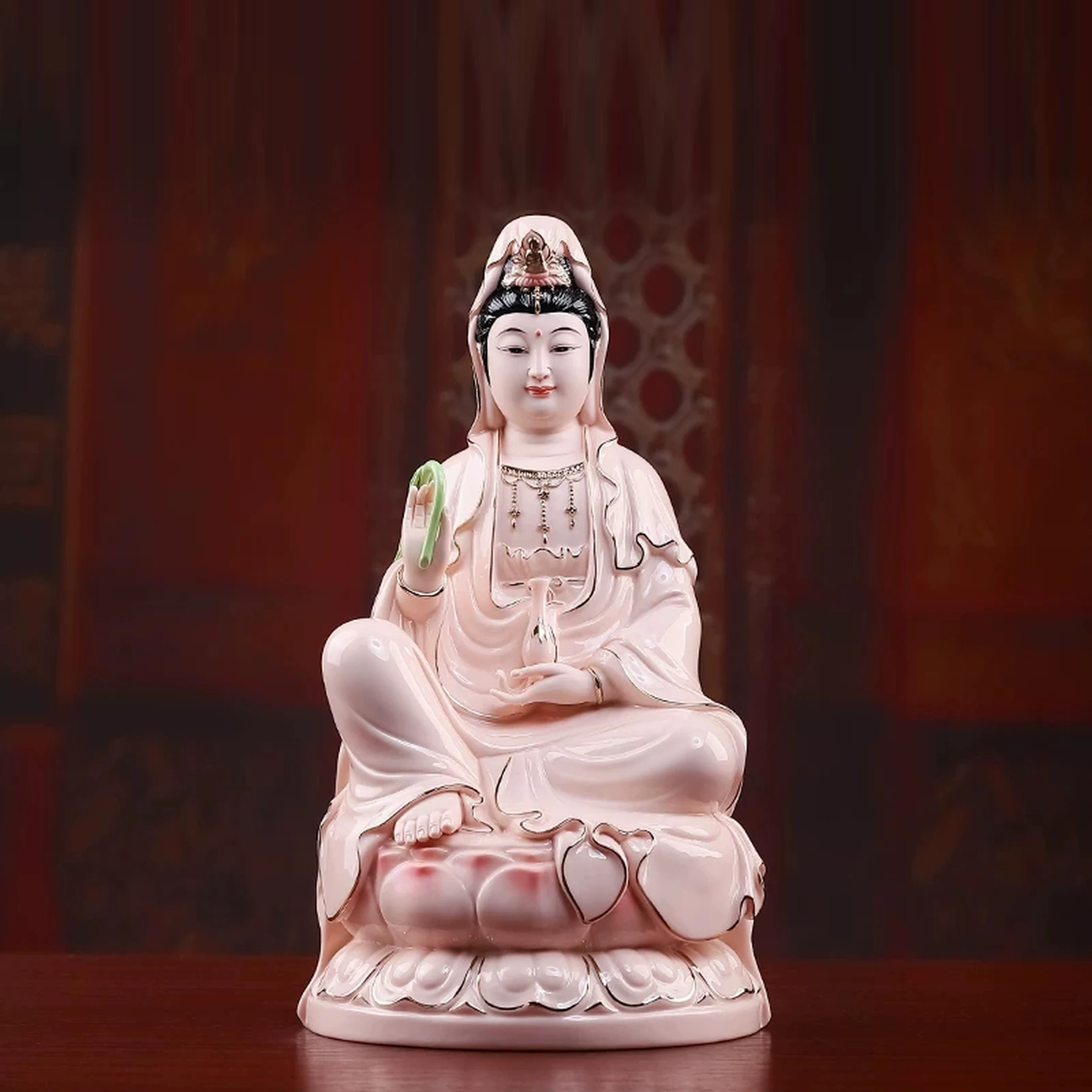 Pink porcelain Guanyin holding a green willow branch and pale pink vase, with gold-colored robe outlines; front view on a rounded lotus, 30.5 cm (12.0 in) tall