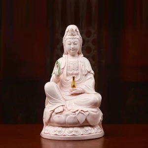 Pink porcelain Guanyin holding a green willow branch and gold-colored vase; front view on a rounded lotus, 30 cm (11.8 in) tall