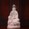 Pink porcelain Guanyin holding a green willow branch and pale pink vase, with gold-colored robe outlines; front view on a rounded lotus, 36 cm (14.2 in) tall