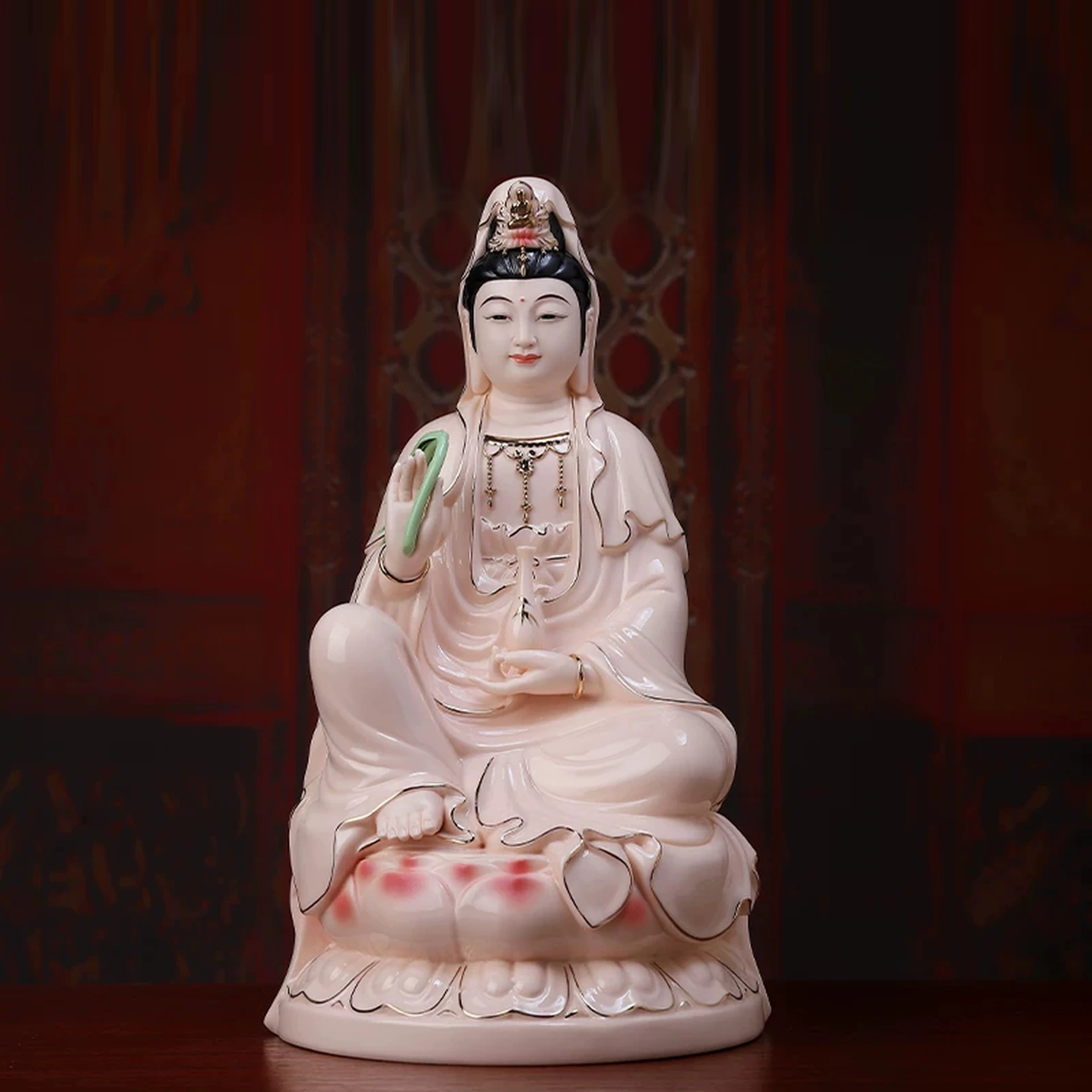 Pink porcelain Guanyin holding a green willow branch and pale pink vase, with gold-colored robe outlines; front view on a rounded lotus, 36 cm (14.2 in) tall