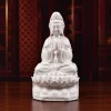 29.5 cm (11.6 in) white porcelain Hezhang Guanyin with joined palms, a vase on the lap and open lotus petals
