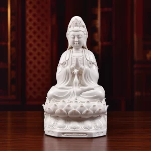 29.5 cm (11.6 in) white porcelain Hezhang Guanyin with joined palms, a vase on the lap and open lotus petals