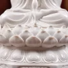 Finely ridged lotus petals and raised ornament on the base of the 29.5 cm (11.6 in) Hezhang Guanyin