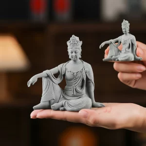 Royal Ease Guanyin — Medium and small size reference · Sold individually Medium 11 cm Guanyin on a palm beside the small 6.5 cm version held in a hand; sold individually
