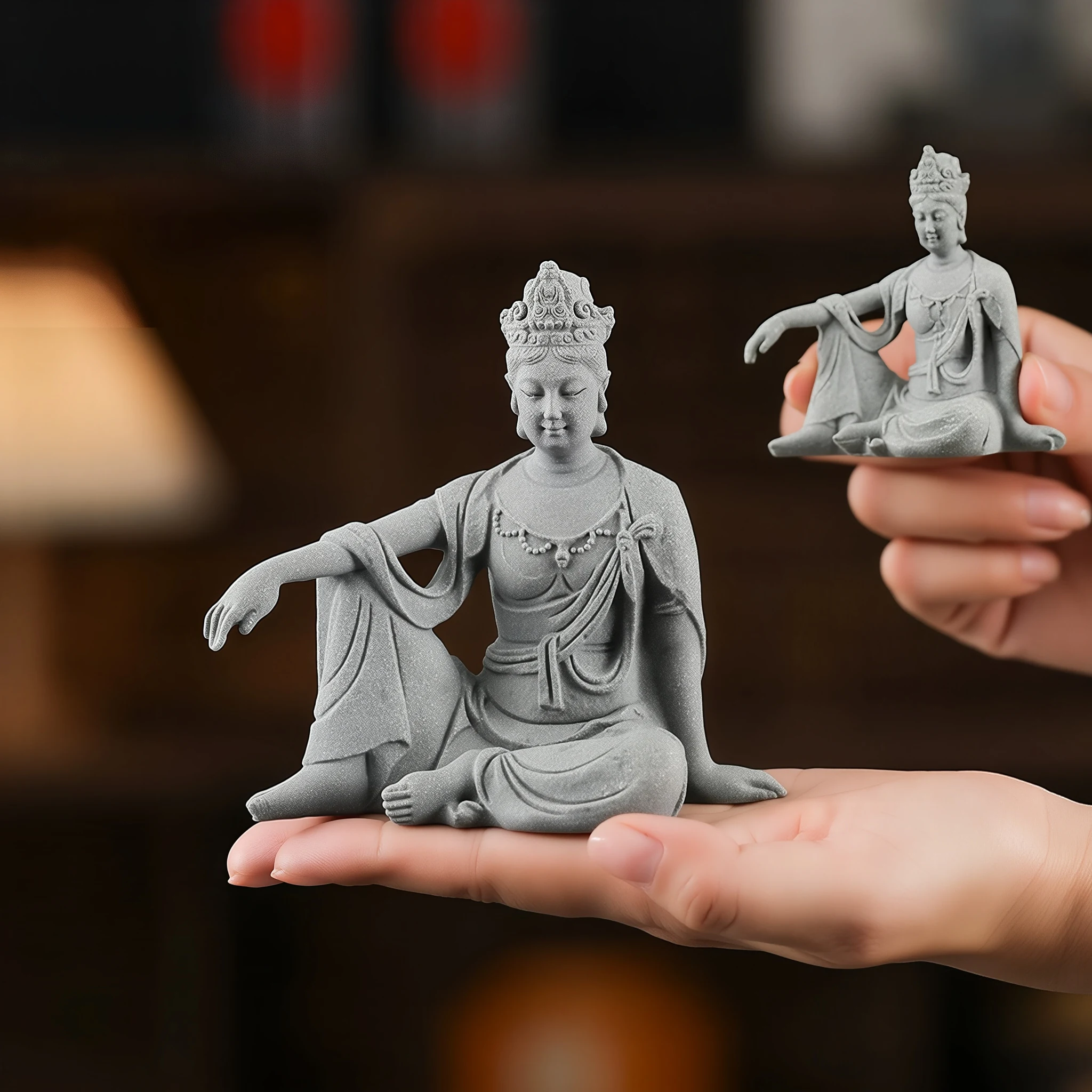 Medium 11 cm Guanyin on a palm beside the small 6.5 cm version held in a hand; sold individually