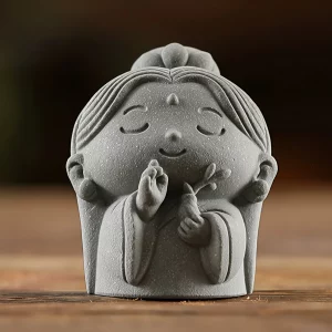 Ruyi Guanyin figurine in gray with a smiling face, raised hand and tiny vase, 5 cm high