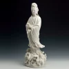 Three-quarter view of the white Ruyi Guanyin statue, showing the flowing robe and pierced lotus base
