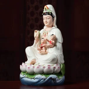 Three-quarter view of the blue-wave Songzi Kuan Yin statue showing both children and the folded white robes