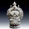 White porcelain Thousand-Armed Guanyin seated on a lotus base, with joined palms and a fan of hands