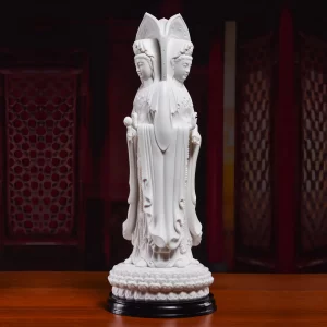Nanhai Three-Faced Guanyin — Unglazed White — Two-Face View Two faces of the matte white Sanmian Guanyin, with the full lotus pedestal and separate black stand