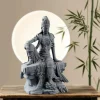 22.5 cm Water Moon Guanyin in a bamboo display setting with a round light behind the statue