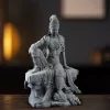 22.5 cm Water Moon Guanyin seated on a rock-shaped base with the right hand over the raised knee