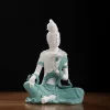 29 cm (11.4 in) Water Moon Guanyin statue in teal & white, seated with one knee raised and holding a lotus flower