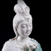Close-up of the Water Moon Guanyin statue’s face, crown and white veil against teal robes