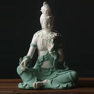 Teal and white Water Moon Guanyin statue seated with one knee raised, shown in a still from the product video