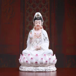 Xiangyun Guanyin — White & Gold Accents — 30 cm — Front view, alternate background Xiangyun Kuan Yin in white and gold accents against a warm brown background, showing the full lotus seat and curling cloud relief