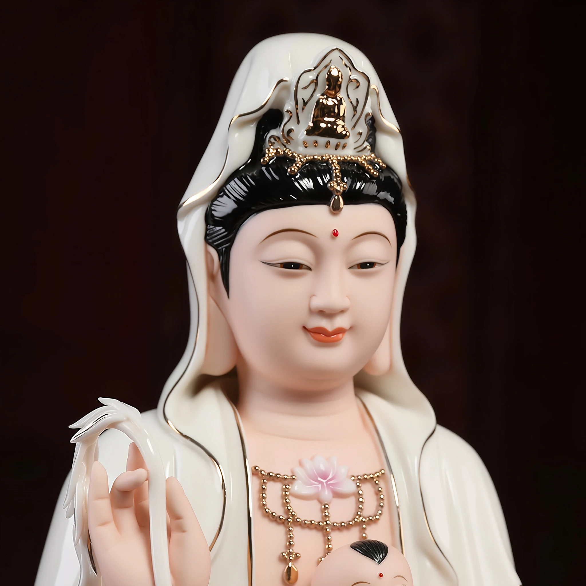 Songzi Kuan Yin’s painted face and crown above the boy with single top hair tuft