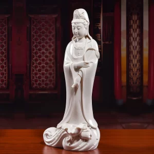 Three-quarter view of Yangzhi Guanyin with the willow branch across her chest and a lowered vase