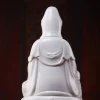 Rear detail of the white Zuolian Guanyin showing the hood and layered robe folds